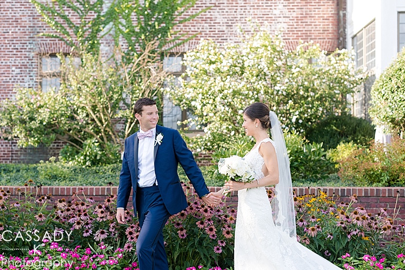 Bride and Groom walk through back gardens during a Hamilton Farm Wedding Gladstone, NJ