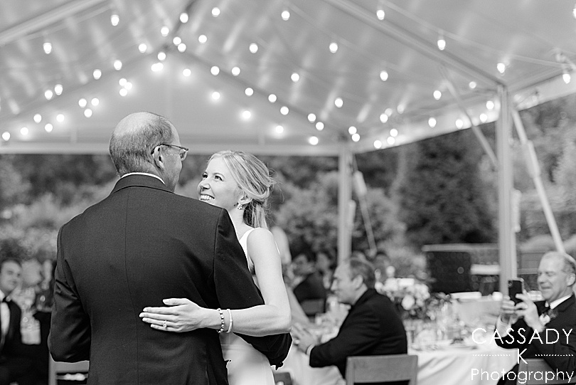 Father and Daughter's dance under the lights of an outside tented reception during a Small Ninety Acres Wedding in Natirar