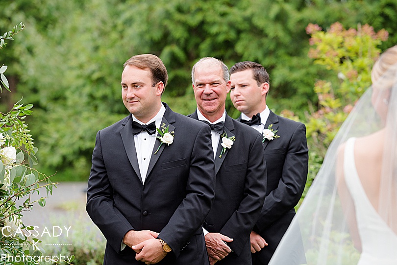 Groomsmen lined up at an outside ceremony at a Small Ninety Acres Wedding in Natirar of Peapack, NJ