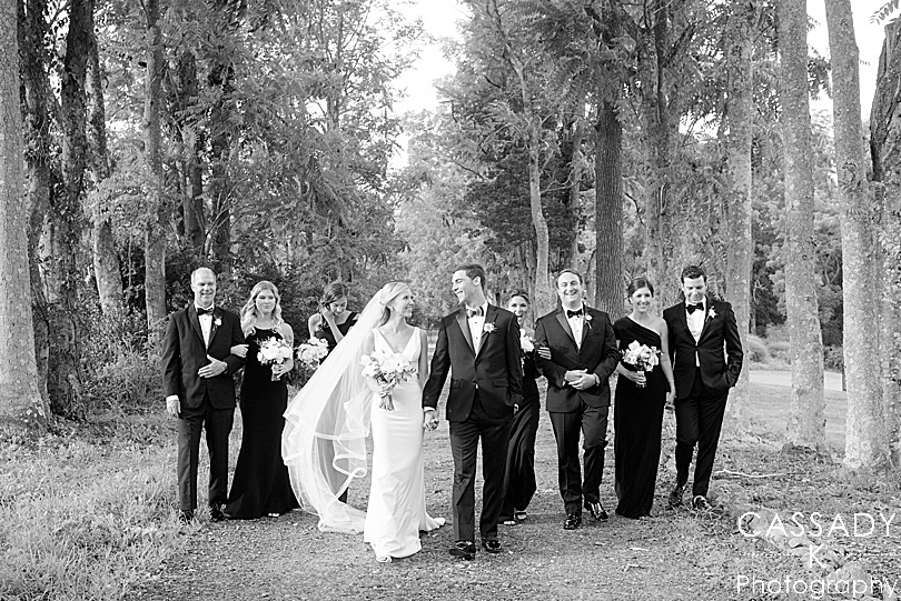 Bridal Party walking down a grove of trees during a Small Ninety Acres Wedding in Natirar of Peapack, NJ