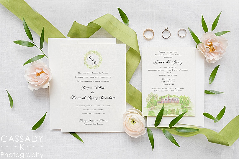 Watercolor invitation suite with green ribbon and florals for a Small Ninety Acres Wedding in Natirar of Peapack, NJ