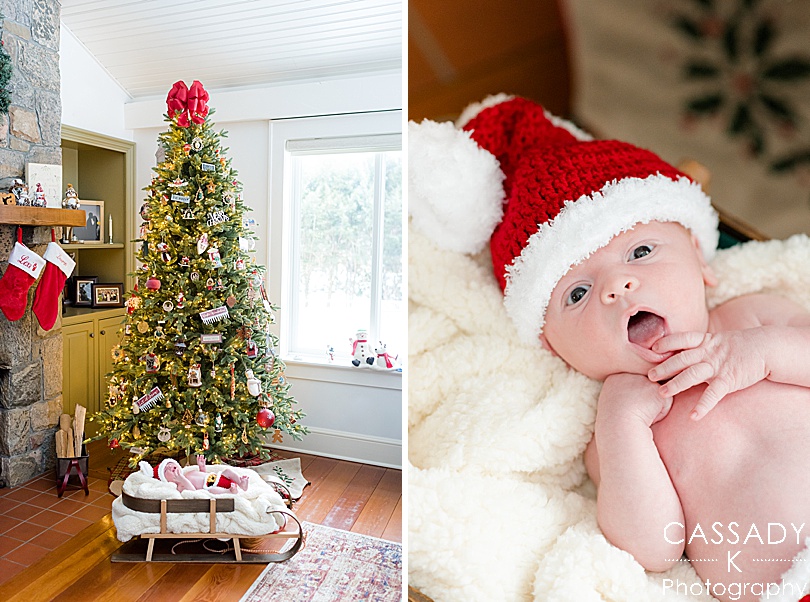 Baby boy dressed in a Santa newborn outfit, laying in a sled during an at home Bedford newborn session in Hudson Valley, NY
