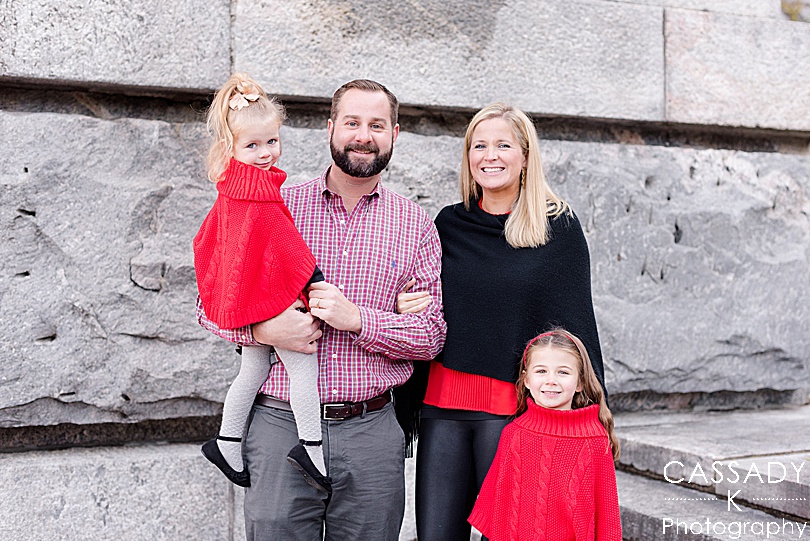 Family in red and black for Christmas pictures during fall mini sessions in Westchester County, NY for a 2020 photography review