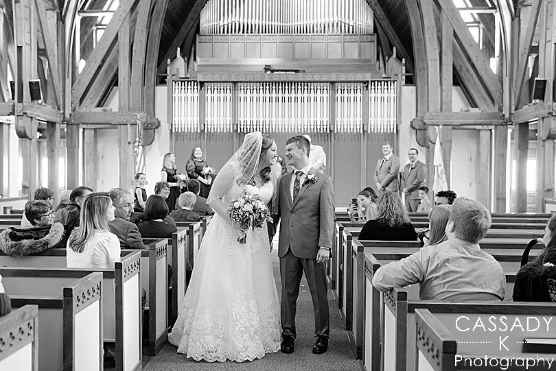Black and White of Bride and Groom married and exiting the church in the Finger Lakes for the 2020 photography review