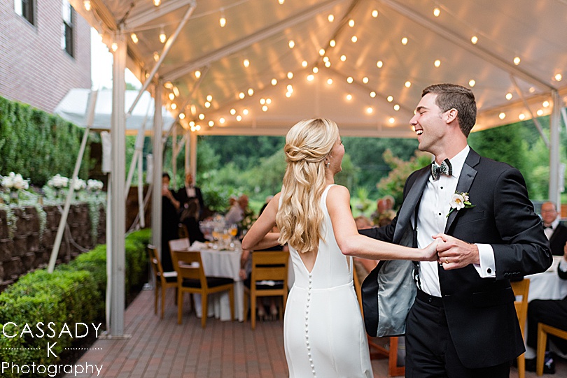 Bride and Groom dance at their outdoor tented reception at a small Ninety Acres wedding during a 2020 photography review