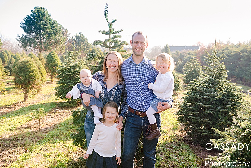 Family of 5 Holiday portrait with three girls at a Christmas tree farm in Harleysville, PA for a 2020 photography review