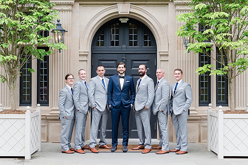 Navy tux for Groom and gray groomsmen suits for a Mansion at Natirar Wedding in Peakpack, NJ