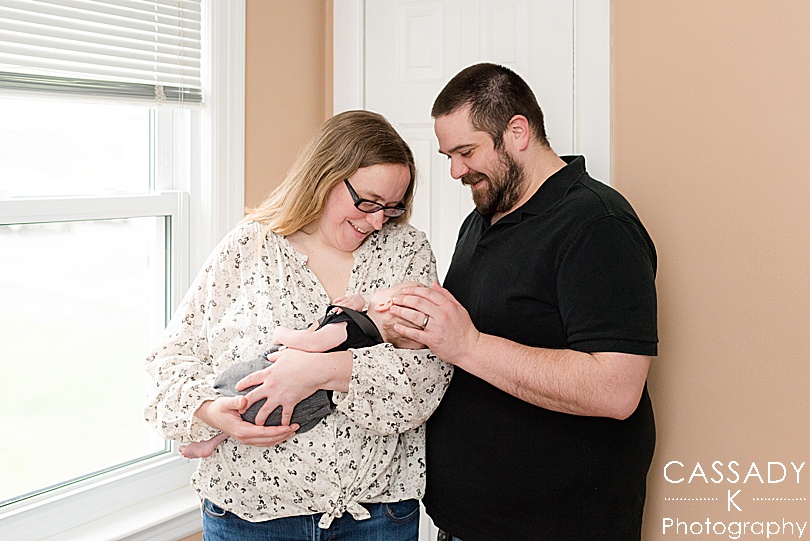 Parents hold miracle baby during Bellefonte Home Newborn Pictures in Centre County, PA