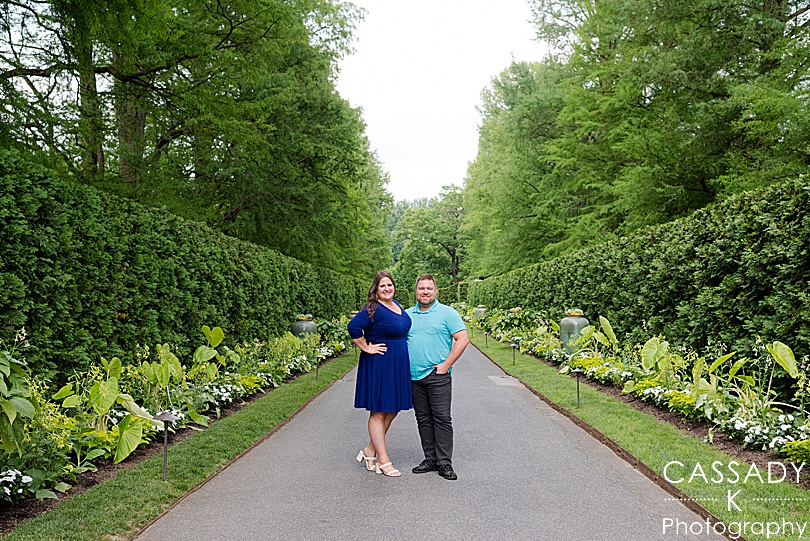 Future bride and groom standing on path at Longwood Gardens for Engagement Photos