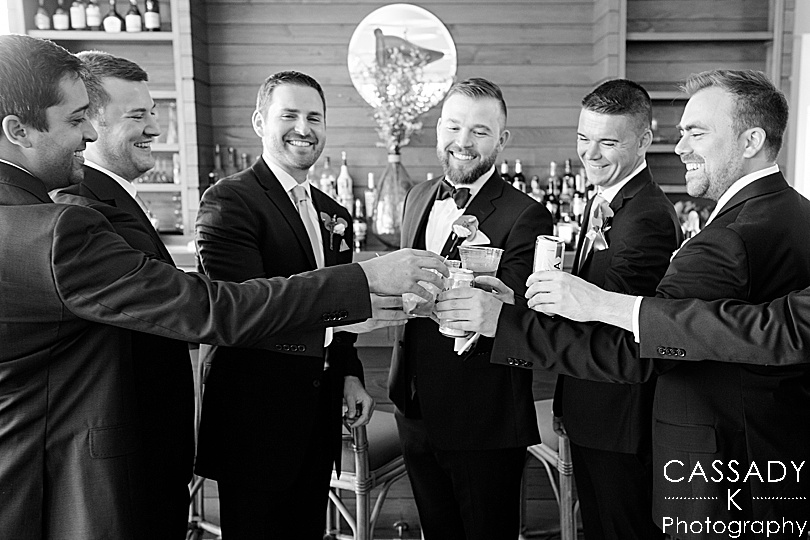 Groom and groomsmen toasting each other at Spring Tokeneke Club Wedding