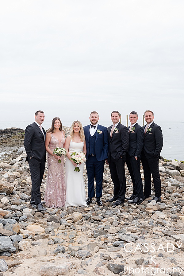 Bridal party formal picture on rock jetty at spring Tokeneke club wedding