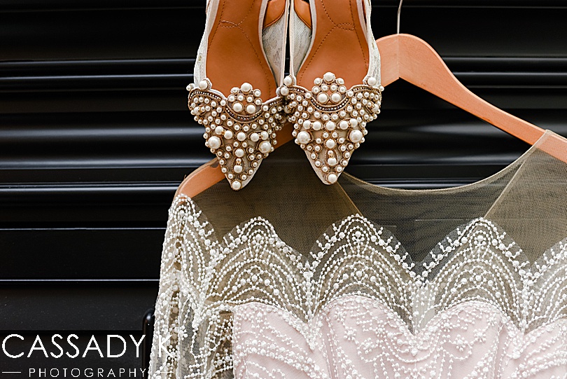 Detail image of shoes and wedding dress at fall Gateway Clipper wedding