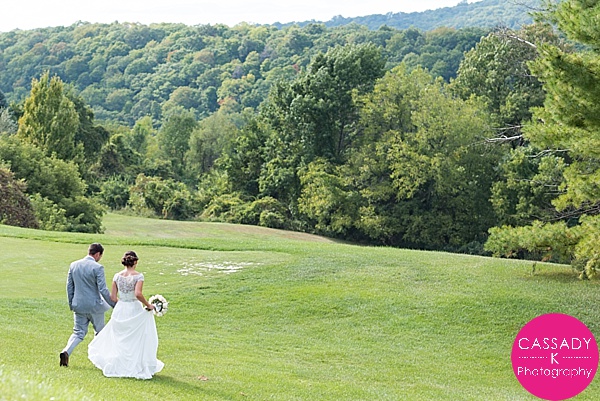 Bride and Groom walking down a hill at a Mineral Resort and Spa Wedding, New Jersey