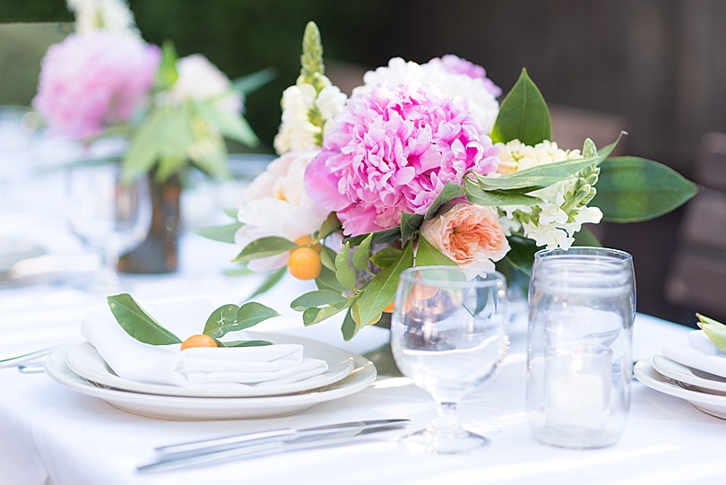 Pink peony centerpiece and kumquat during wedding reception at Frankies 457 in Brooklyn, NY