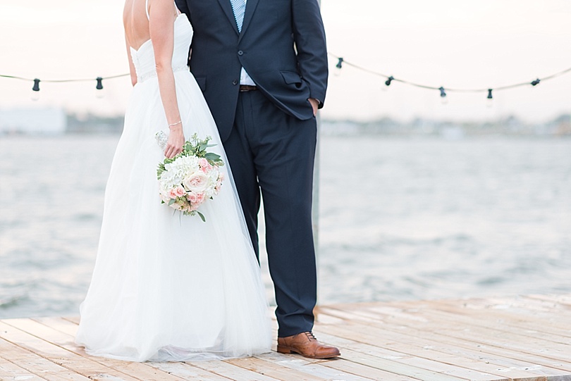 Bride and Groom portrait on the boat dock by the water at Mantoloking Yacht Club during a Mantoloking Wedding in New Jersey