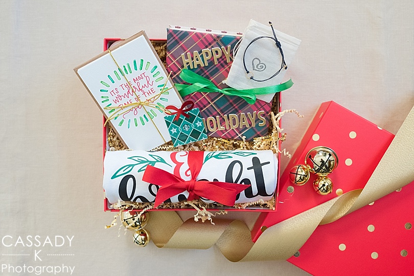 Red and Gold Christmas box filled with items for a Holiday Instagram Giveaway
