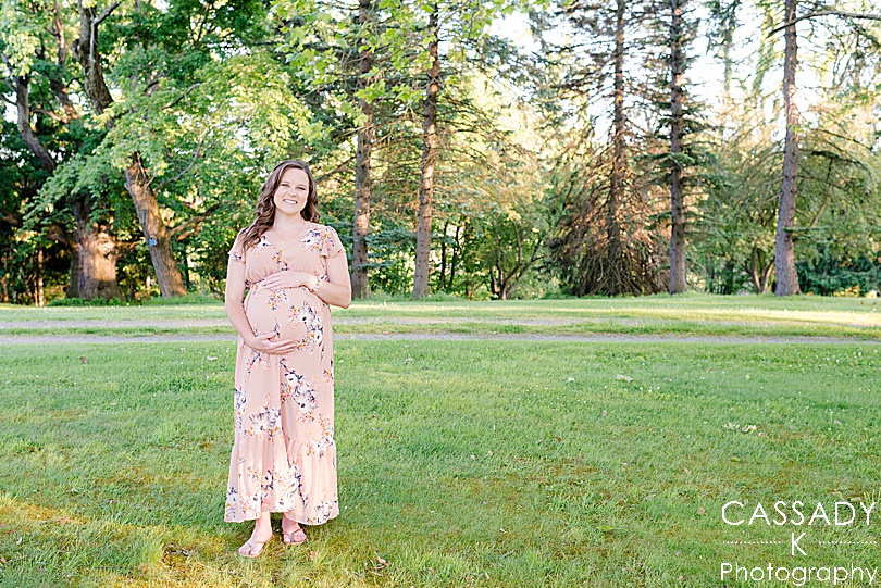 Pregnant Mom Standing and Laughing in a field during Pittsburgh Maternity Session