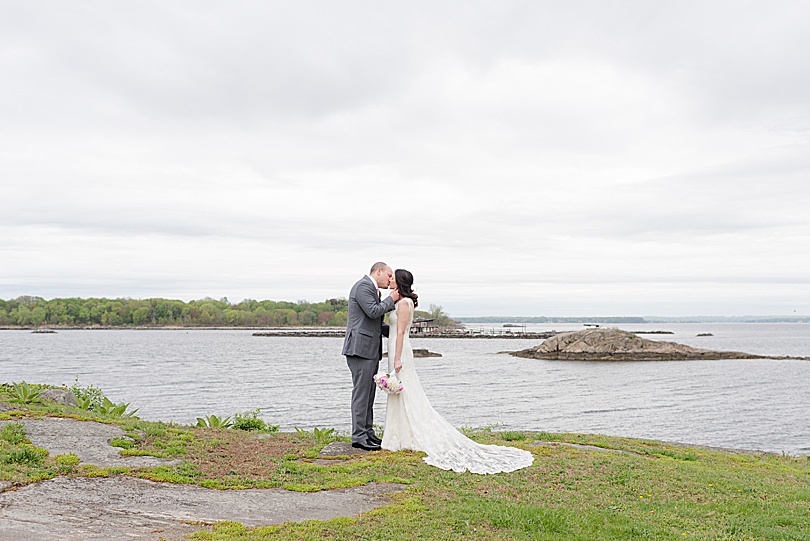 Bride and Groom wide angle portrait along the water before their Jewish Spring Glen Island Wedding in New Rochelle, NY in May
