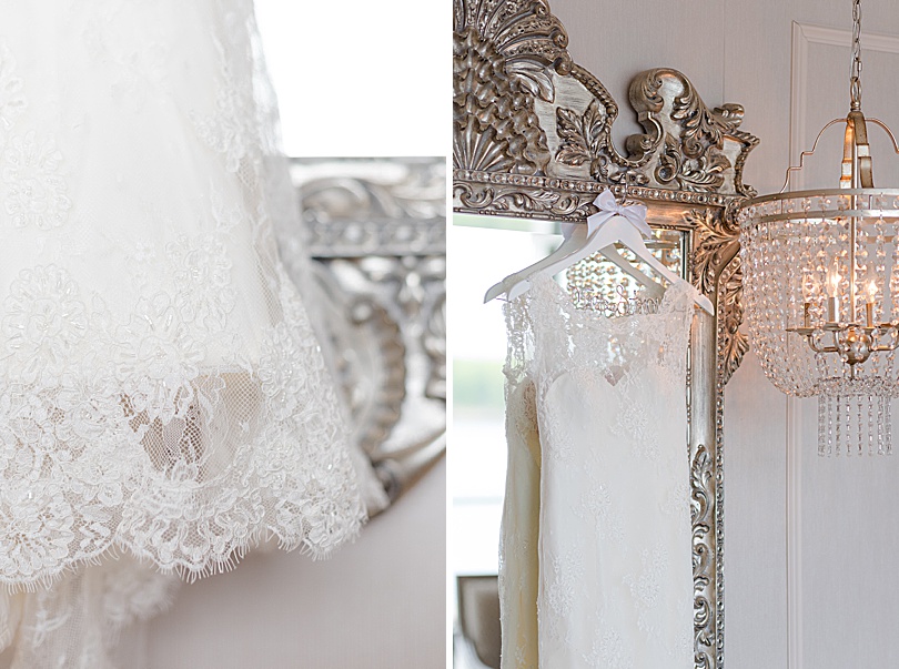 The bride's lace dress hanging on an ornate mirror for a Jewish Spring Glen Island Wedding in New Rochelle, NY