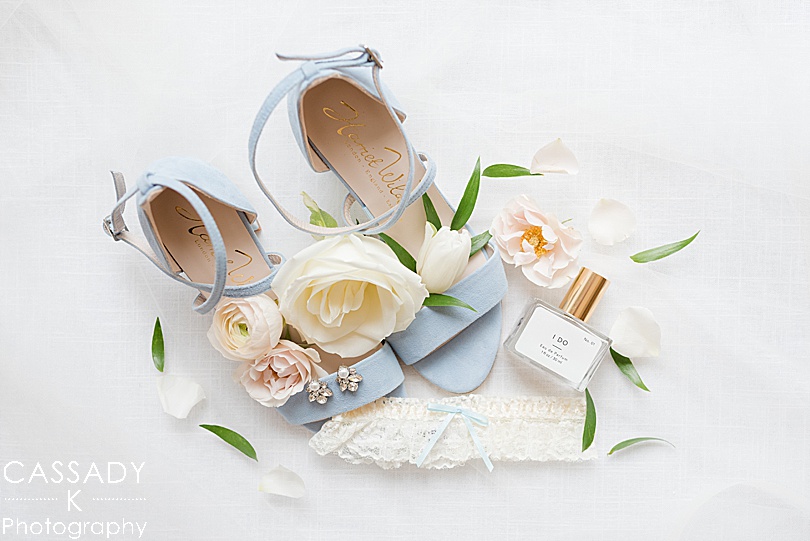 Harriet Wilde Blue Velvet Chunky Heel Shoes, earrings, I Do perfume and a delicate garter for a Small Ninety Acres Wedding