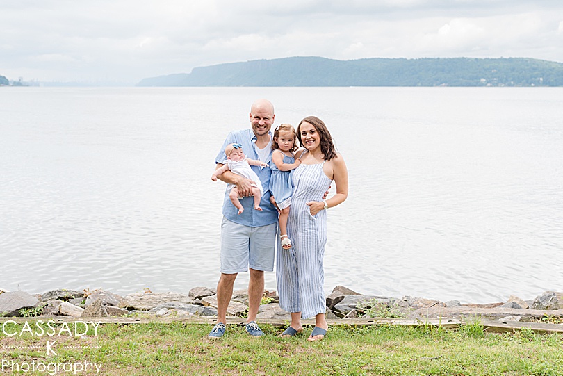 Family in light blue at the Scenic Hudson Park in front of the Hudson River in Irvington, NY for a 2020 photography review