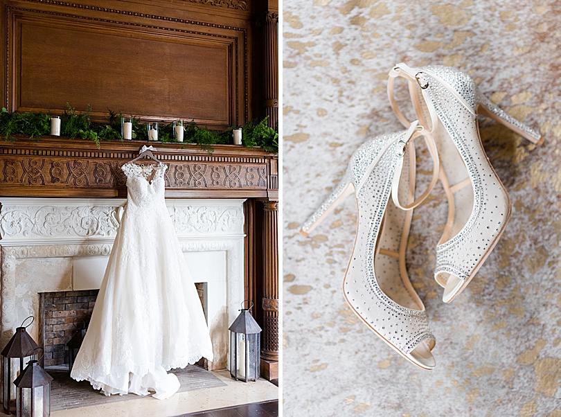 The bride's dress hanging on the dark wood and marble detailed fireplace mantle for a Mansion at Natirar Wedding in Peakpack