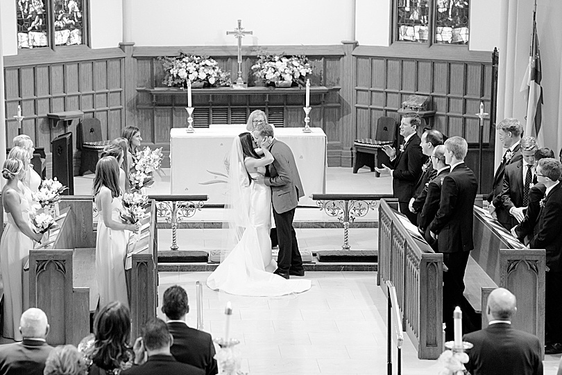 Bride and Groom kiss at the end of ceremony at the Trinity Episcopal Church in Southport, CT for the Tokeneke Club Wedding