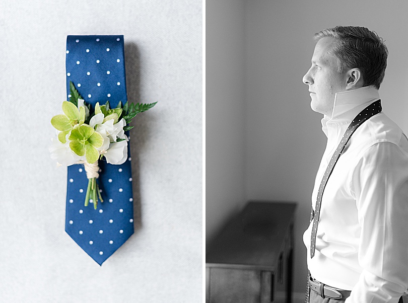 Groom putting on navy polka dot tie and green boutonnière during a Tokeneke Club Wedding in CT