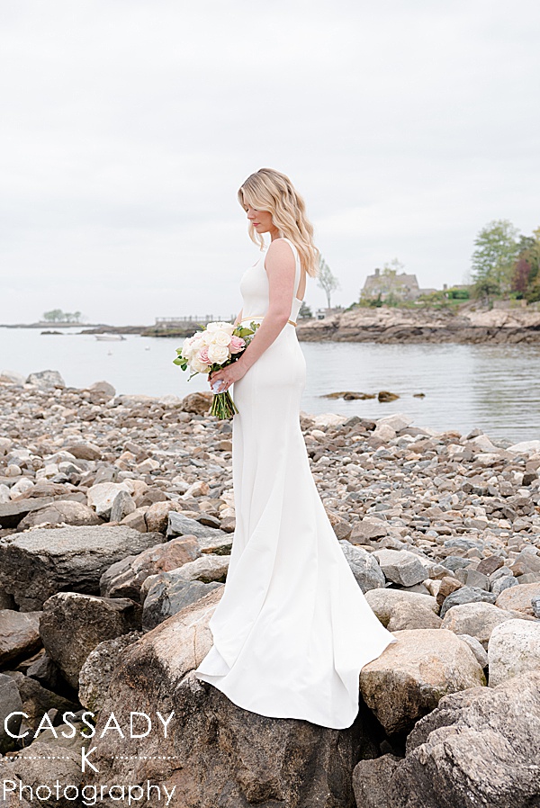 Bride formal picture on rock jetty at spring Tokeneke club wedding