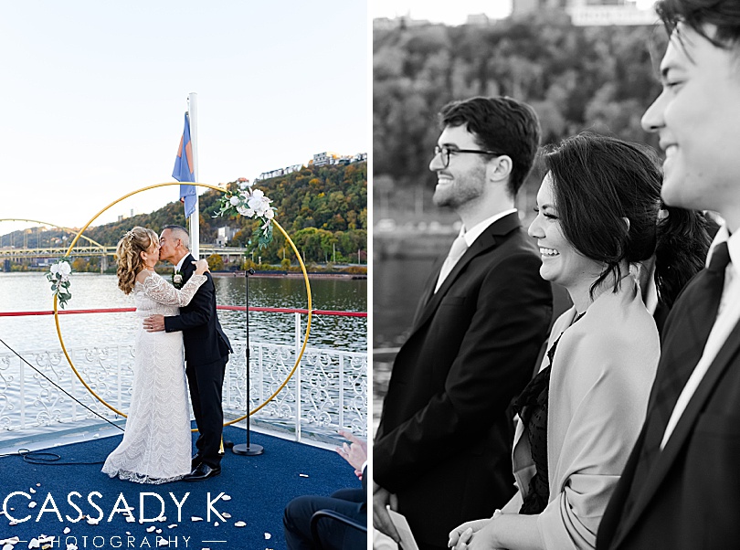 Bride and groom first kiss on the water for fall Gateway Clipper wedding