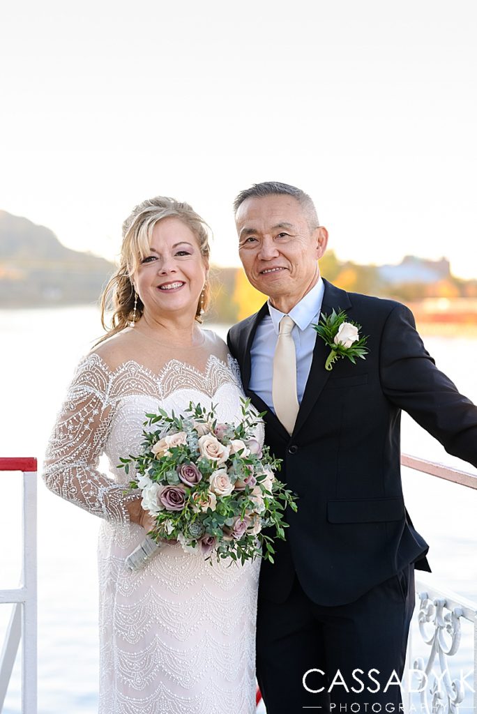 Bride and groom smiling after fall Gateway Clipper wedding