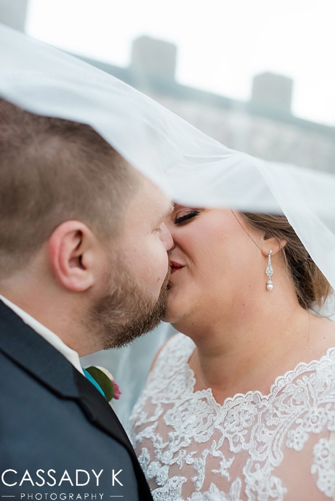 Bride and groom kissing under veil at Mount Hope Estate Wedding