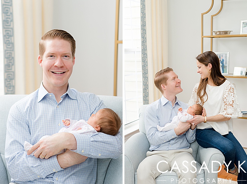 New dad proudly holds daughter during at home newborn session in Doylestown, PA