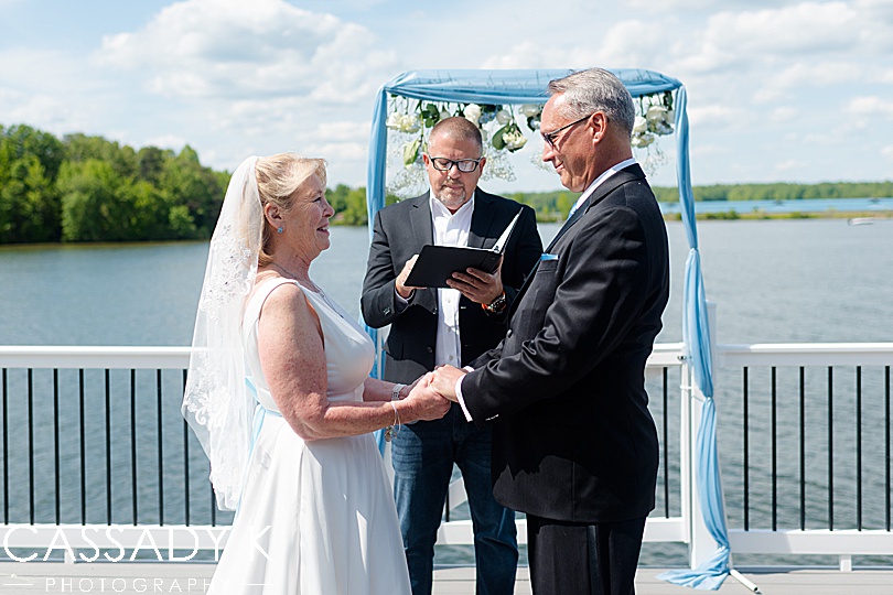 Bride and groom getting married dockside at their small wedding on Lake Anna, VA