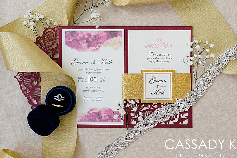 Image of wedding invitation and wedding jewelry