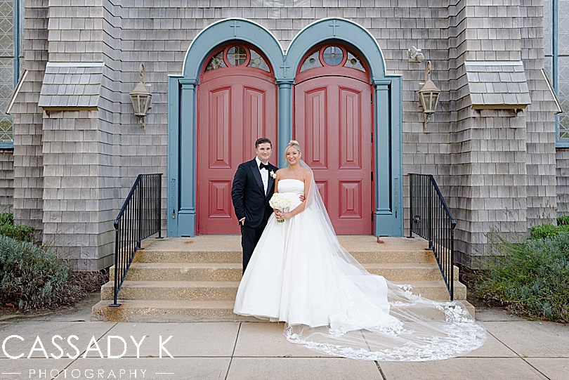 Bride and groom in front of church