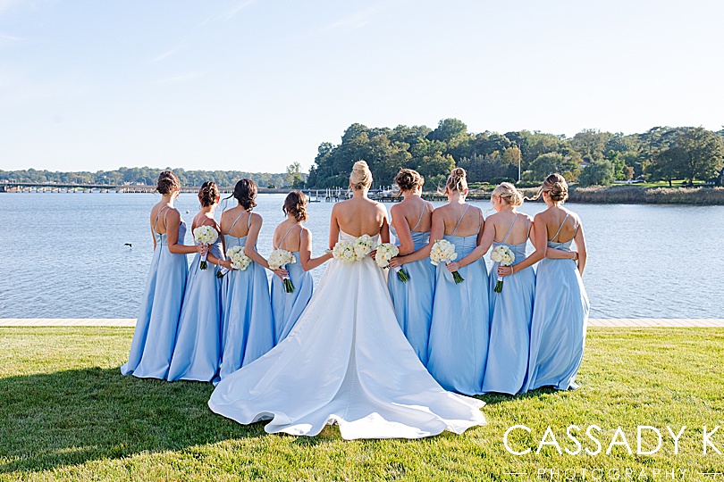 Bridal portraits in front of water at Private Estate Tented Wedding