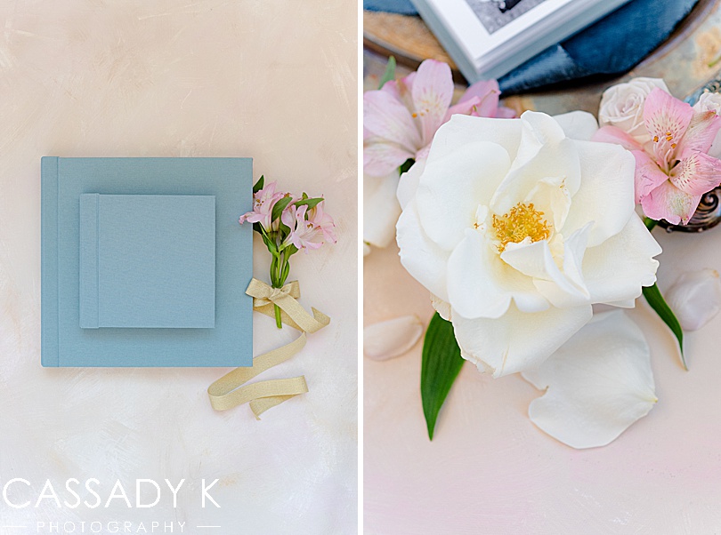Wedding album by Cassady K Photography next to flowers