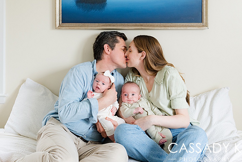 Couple kissing with babies in Philadelphia Lifestyle Newborn Session