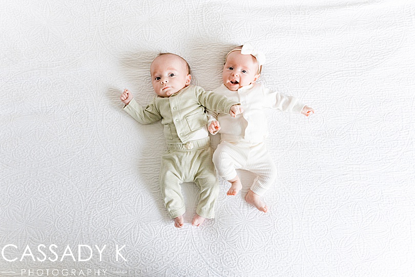 Baby twins on bed in Philadelphia Lifestyle Newborn Session
