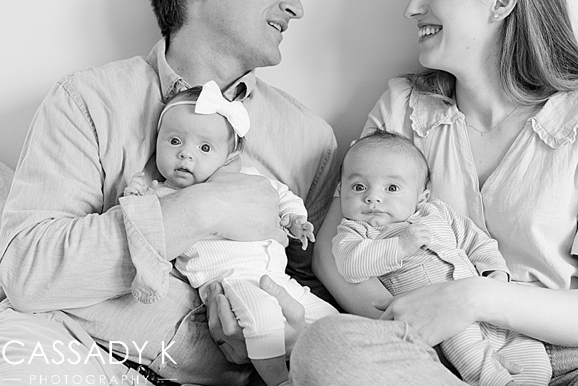 Twin babies on parents in Philadelphia Lifestyle Newborn Session