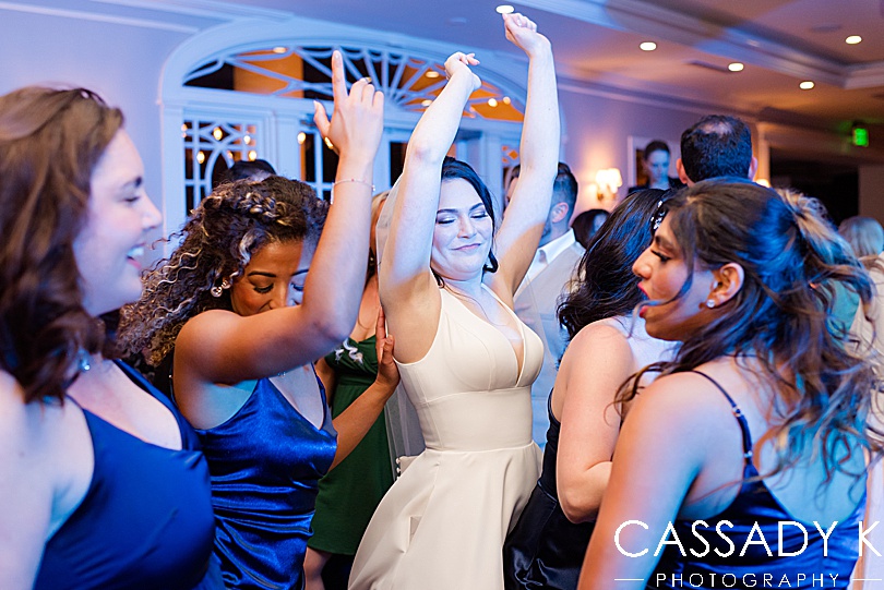 Bride dancing with bridesmaids during Briarcliff Manor Wedding