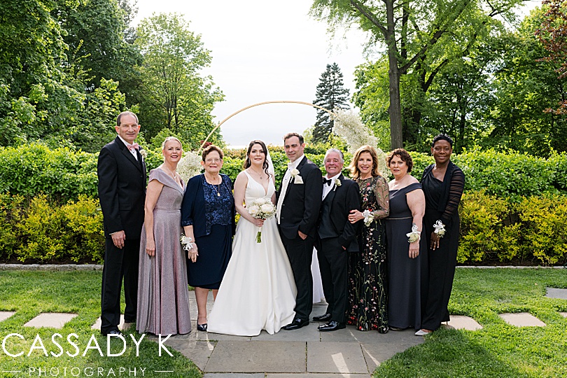 Bride and groom with parents at Briarcliff Manor Wedding