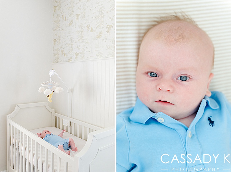 Baby boy in a blue Polo onesie laying in a white crib in his nursery at a growing family lifestyle session 