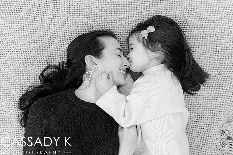 Mom and daughter kiss during PA fall mini session