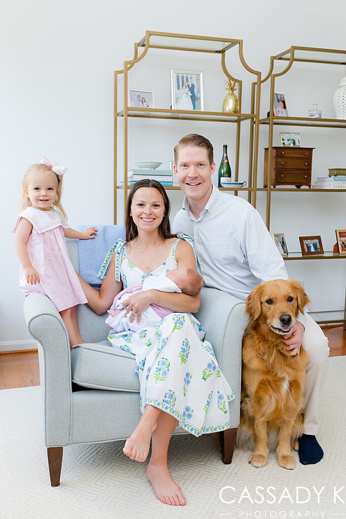 Doylestown family portrait at home with their newborn and toddler daughters, and dog.
