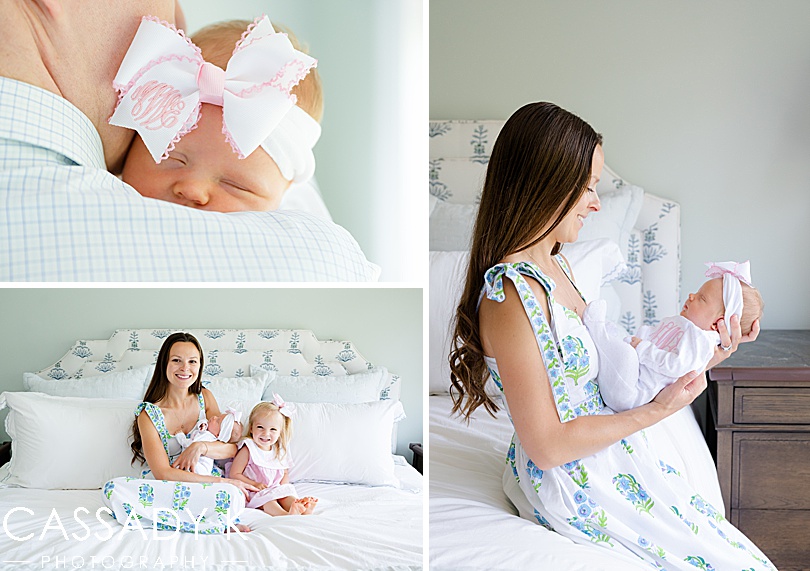 Mom and Dad each snuggle their newborn baby girl during a family photo session